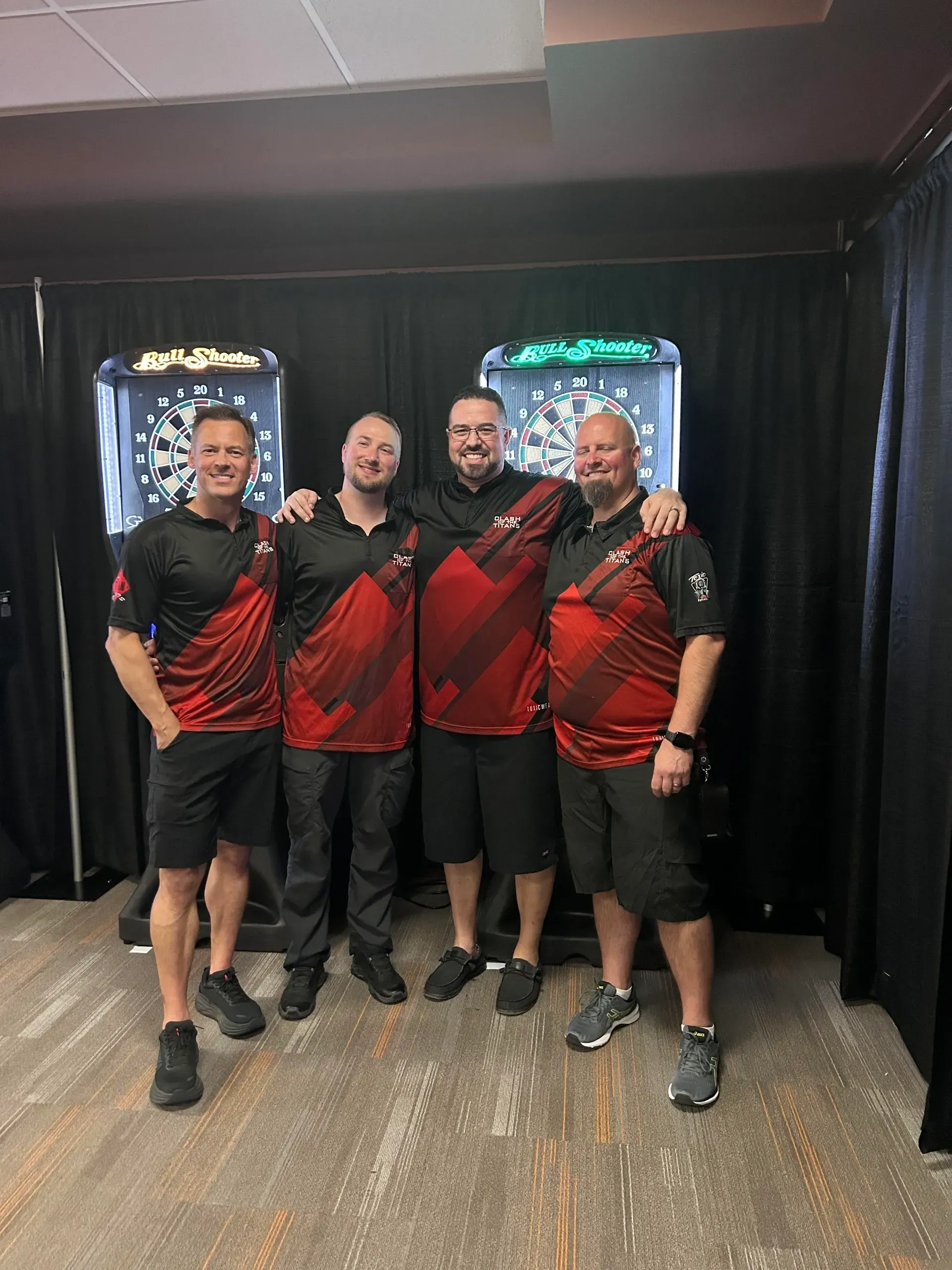 Group of four men in dart team
