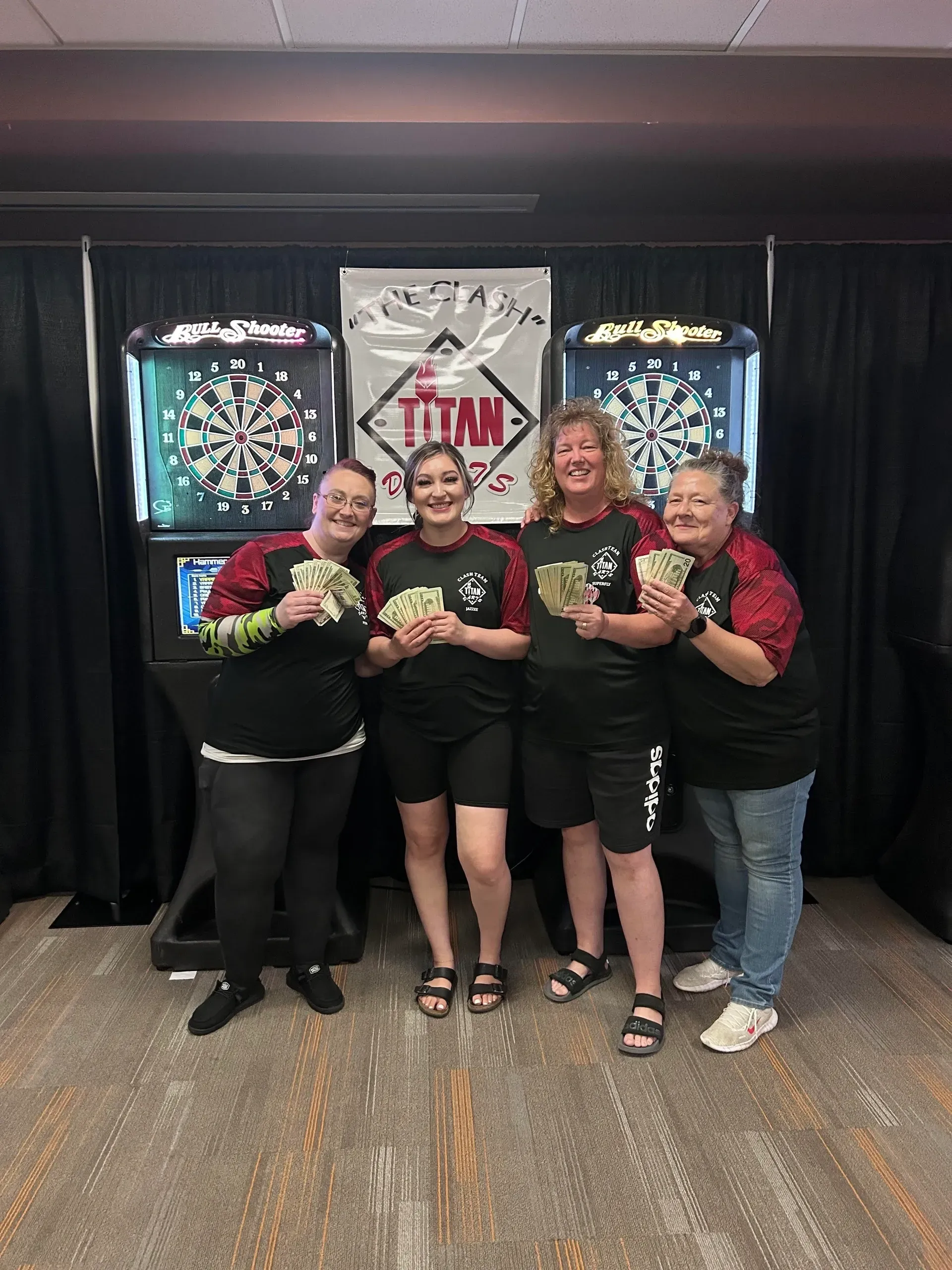 Group of women celebrating dart game win