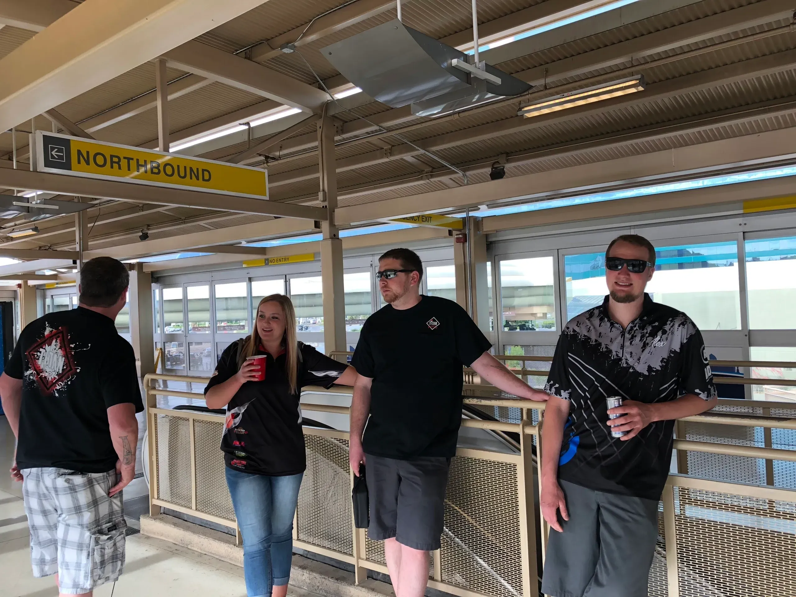 Friends relaxing at transit stop