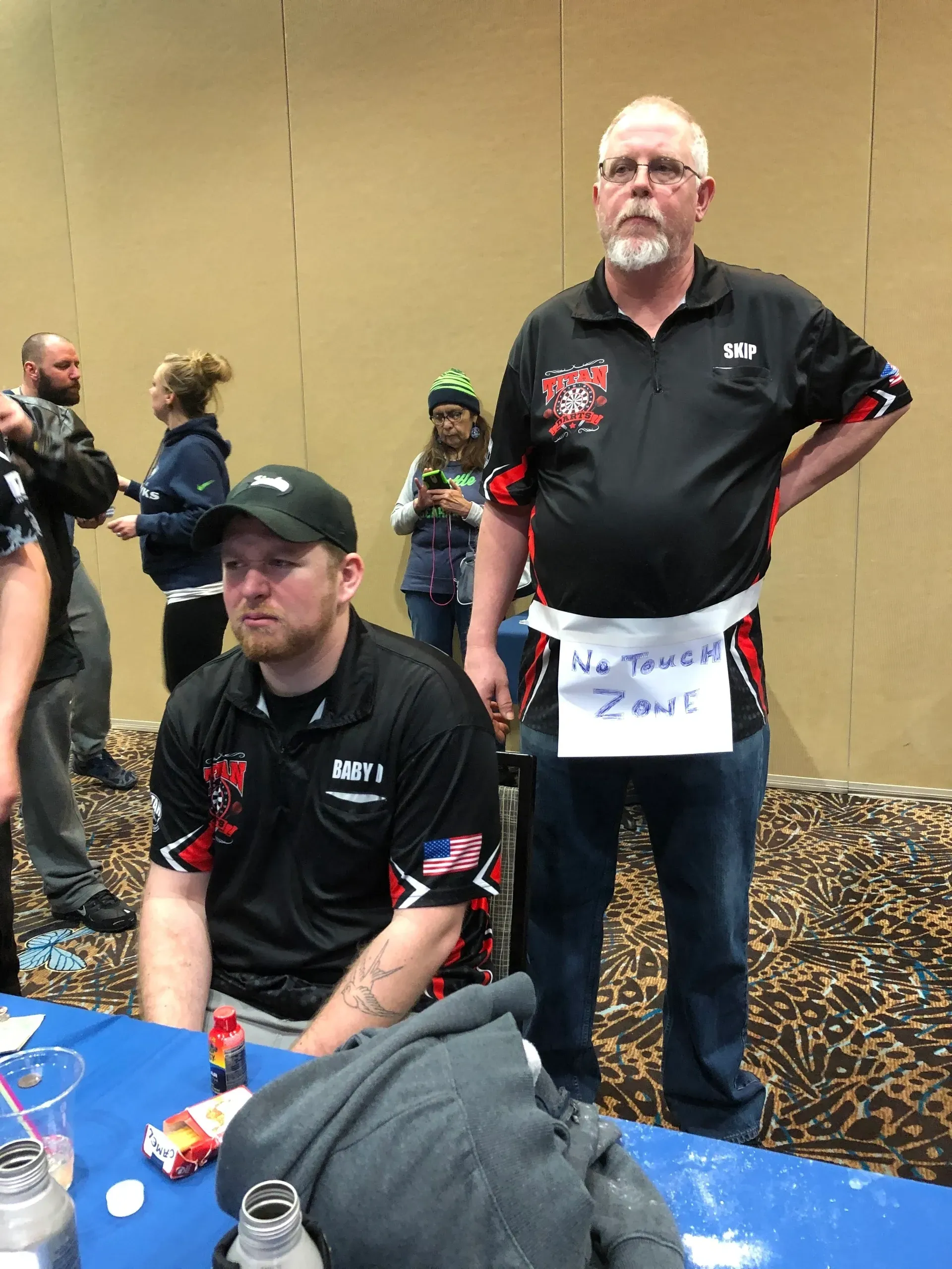 Man with "No Touch Zone" sign
