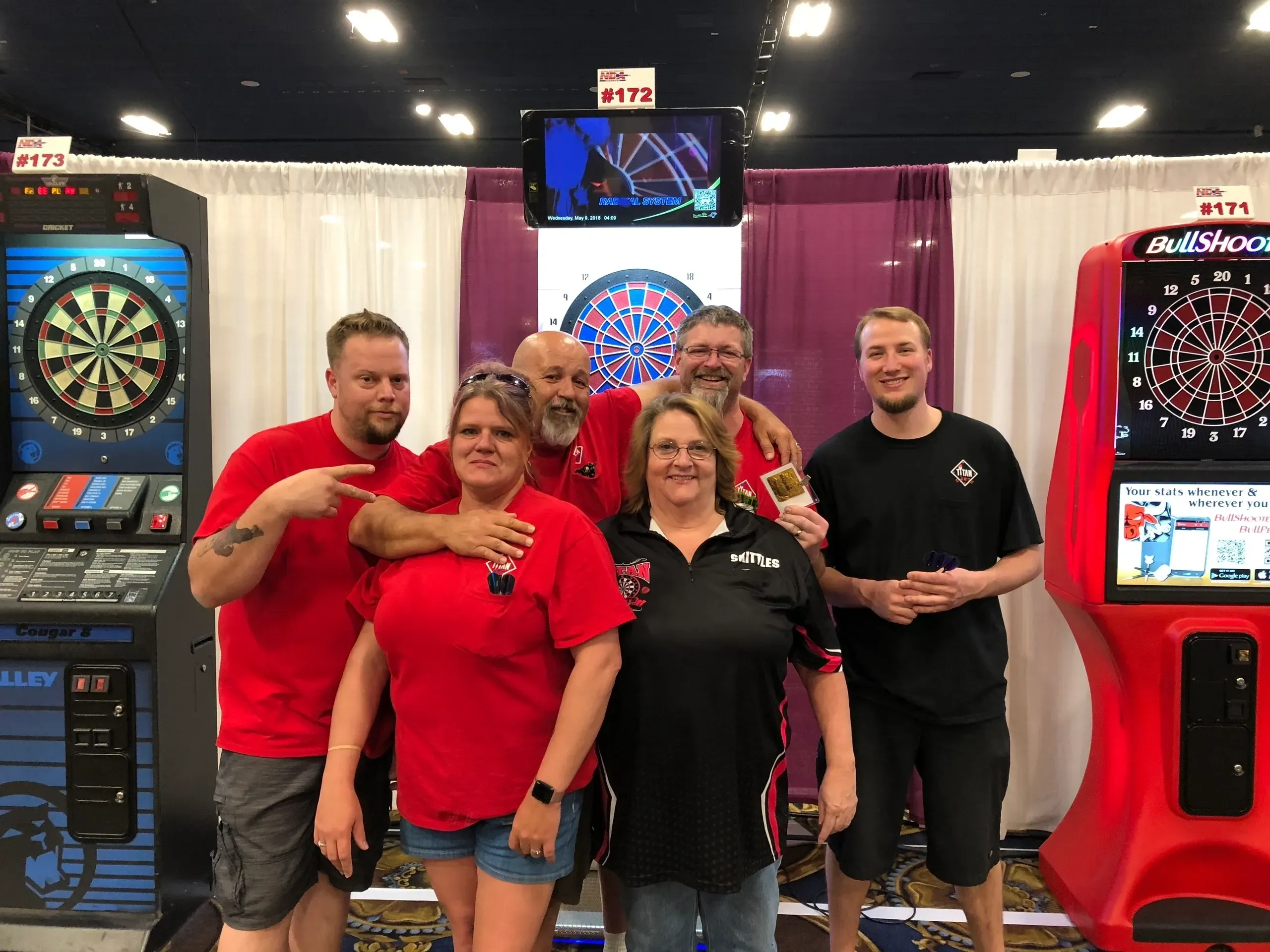 Friends smiling at dart competition
