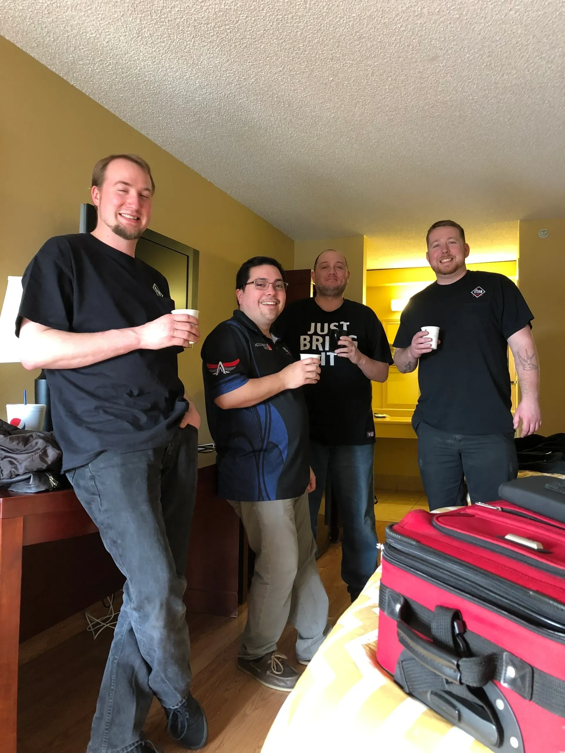 Group of men enjoying drinks indoors