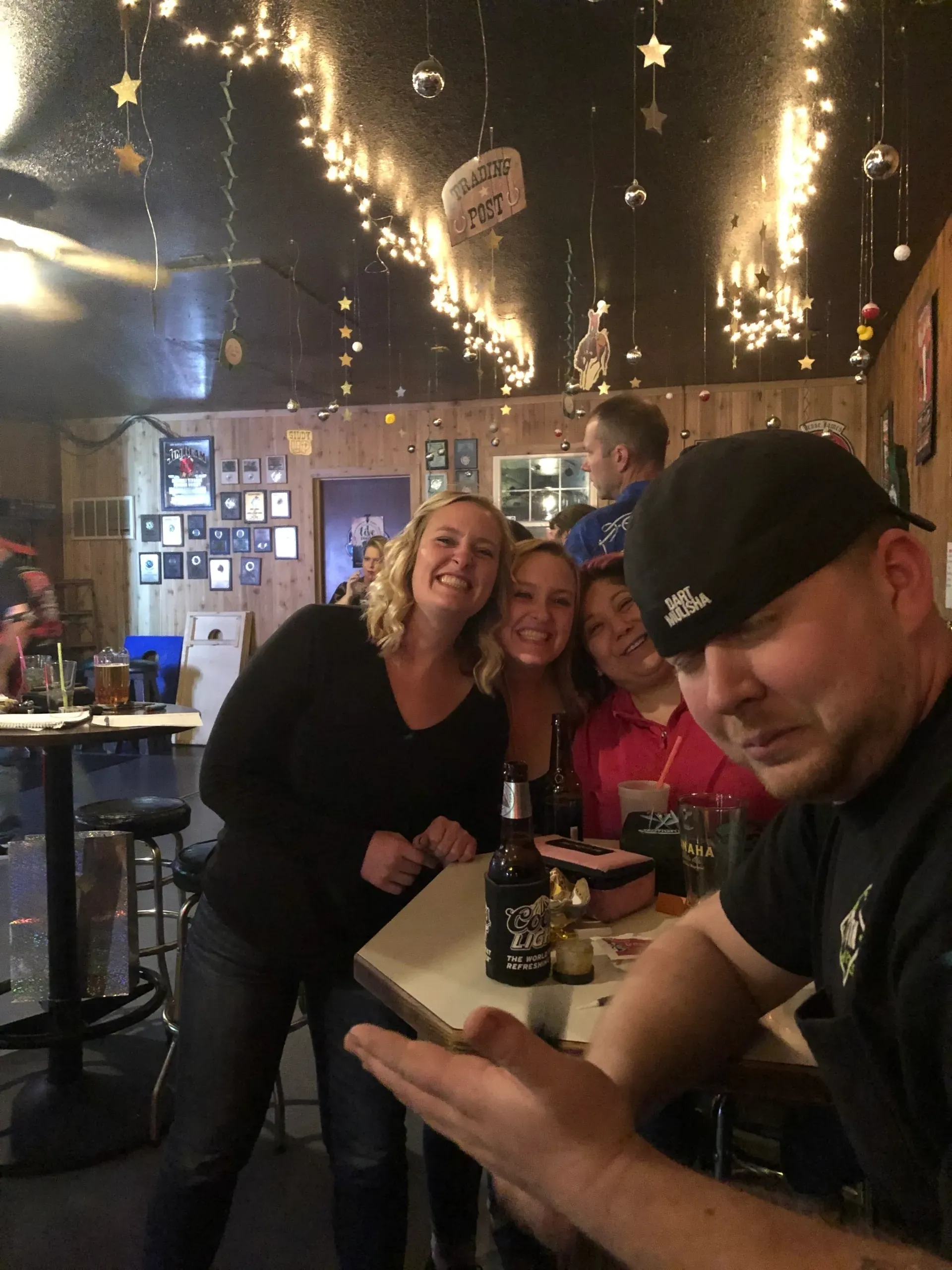 Friends smiling in a cozy pub