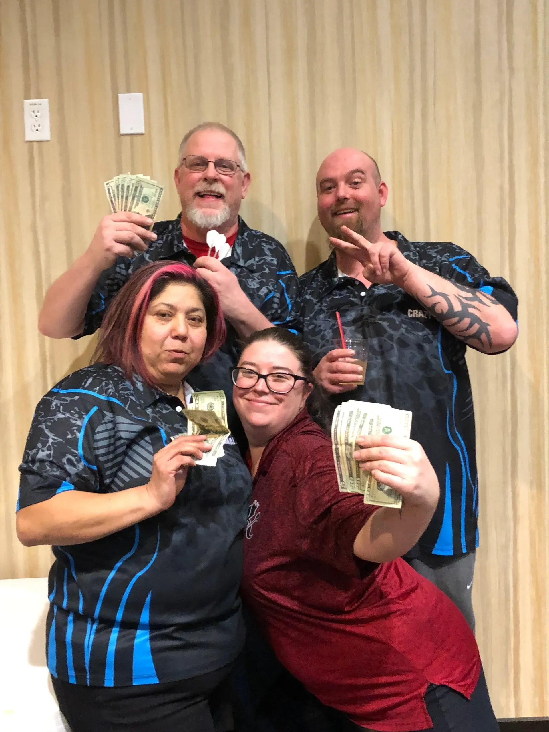 People celebrating with cash in hand