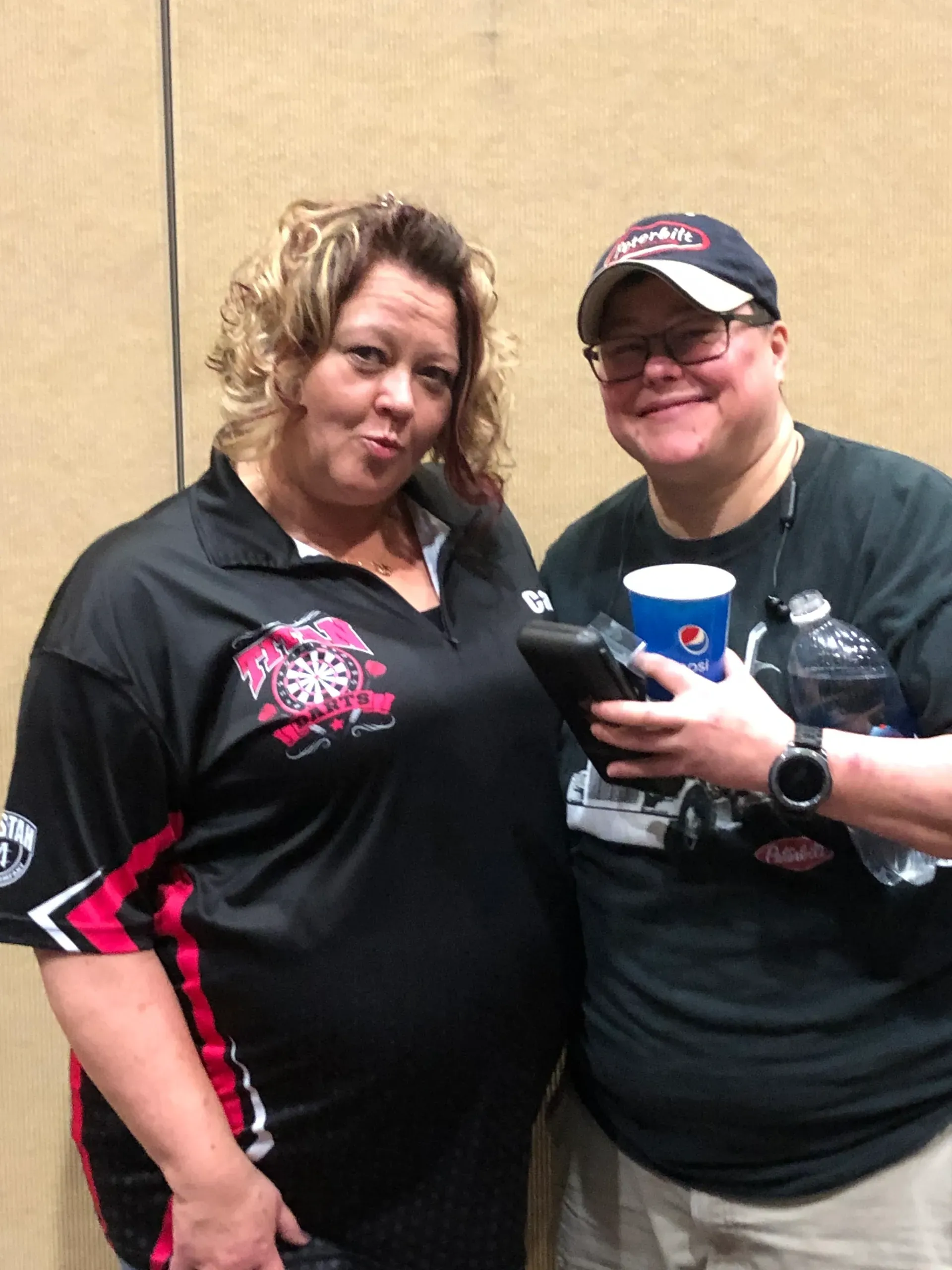 Two people smiling with drinks