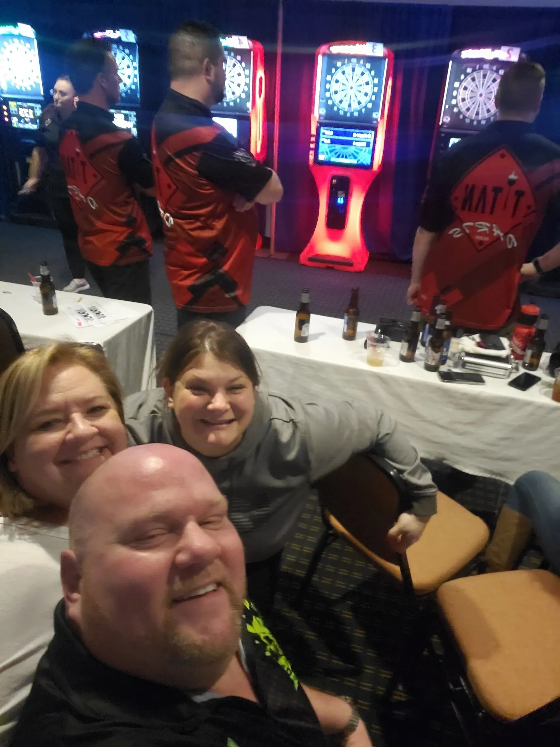 Group enjoying darts tournament